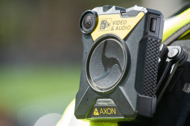 Body camera being worn by police officers in London, to keep officers safe, enabling situation awareness, improving community relations and providing evidence for trials. stock photo
