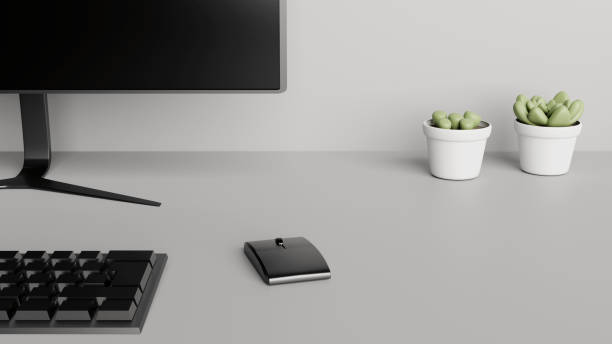 istock Desktop detail with a computer screen, keyboard, mouse and cactus plants 1218949030