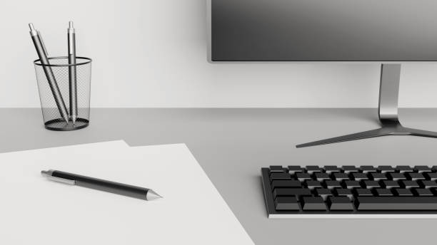 istock Desktop detail with a computer screen, keyboard, papers and pens 1218949043