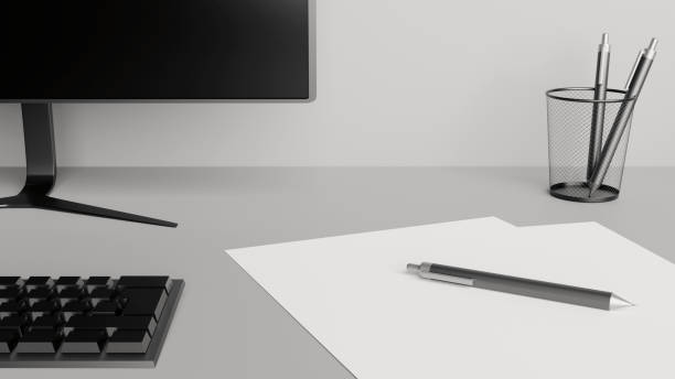 istock Desktop detail with a computer screen, keyboard, papers and pens 1218949911