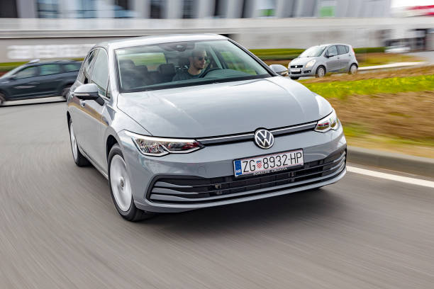 new volkswagen golf driving - speed horizontal commercial land vehicle automobile industry imagens e fotografias de stock