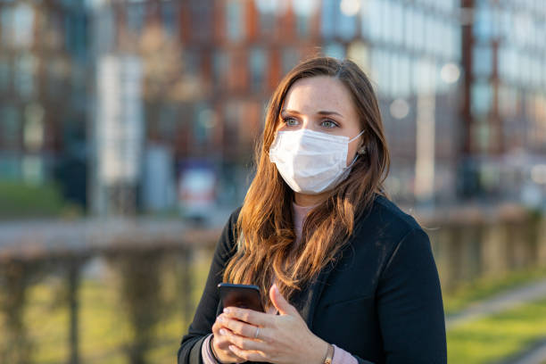 istock Woman wearing a face mask 1218954824