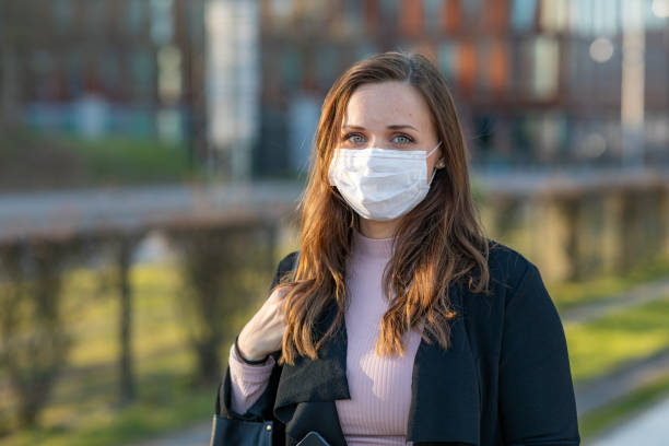 istock Woman wearing a face mask 1218954831