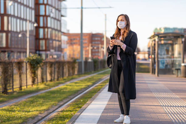Commuting woman wearing a face mask