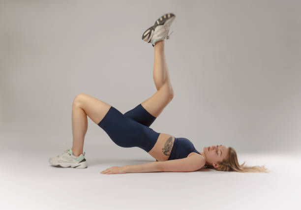 istock athletic girl posing in the Studio on a white background 1218954889