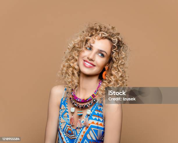 Cute Woman In Boho Style Outfit Against Brown Background Stock Photo - Download Image Now