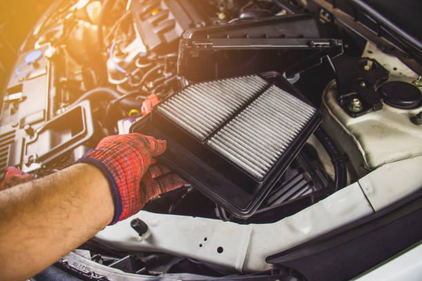 car air filter in a hand of mechanic man. - air filter car motor vehicle engine imagens e fotografias de stock