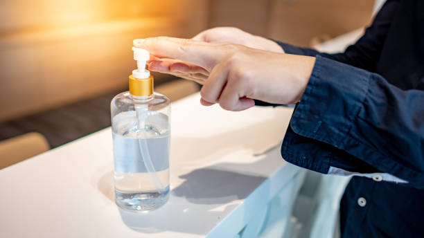 istock Washing hands by alcohol sanitizer bottle 1218957081