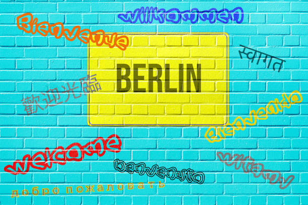 istock A wall with a berlin plaque and welcome in different languages 1218959501