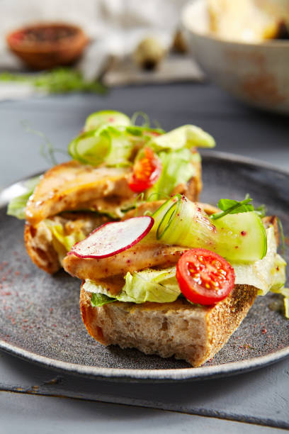 istock Bruschetta with turkey in nut sauce in gray plate 1218959620