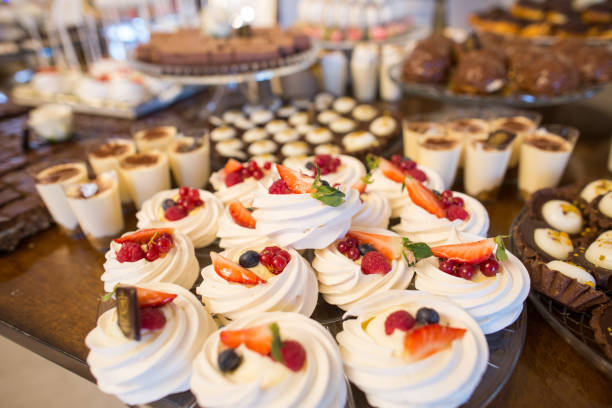 istock Delicious candy bar with macaroons, cupcakes and other sweets 1218959794