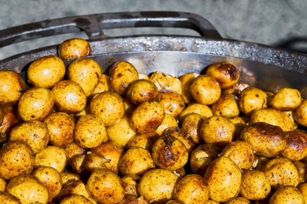 istock Fried baby potatoes in a frying pan. Top view 1218961103