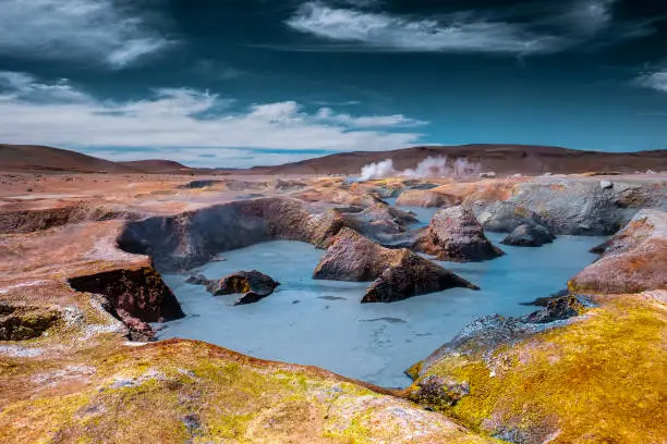 Geothermal area named Sol de Manana in Bolivian Altiplano with steams, sulfur springs and lakes with boling mud