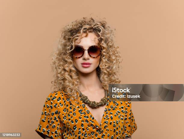 Fashion Portrait Of Curly Hair Woman In Leopard Print Dress Stock Photo - Download Image Now