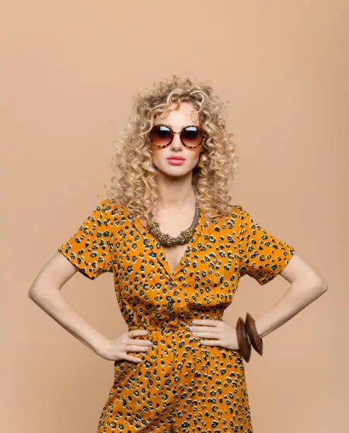 Photo of Fashion portrait of woman in leopard print dress