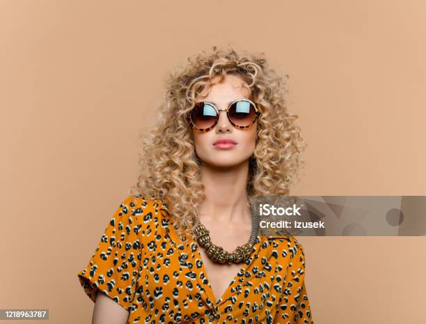 Summer Portrait Of Curly Hair Woman In Leopard Print Dress Stock Photo - Download Image Now