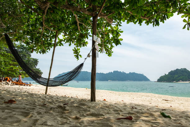 istock empty hammock for relaxing at the beach during summer vacation at Pangkor Island located in Perak State, Malaysia 1218964191