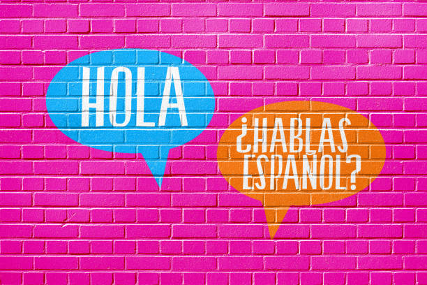 A wall, language school and question Speak Spanish stock photo