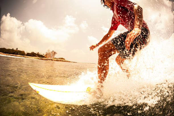 istock Surfer rides the ocean wave with lots of splashes 1218965781