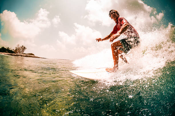 istock Surfer rides the ocean wave with lots of splashes 1218965829
