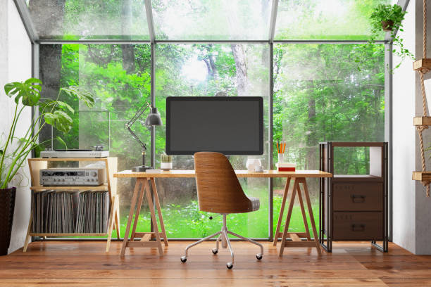 lavora a casa concept home office interni con monitor computer e vista giardino - green tree monitor foto e immagini stock