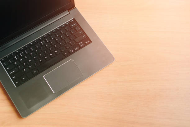 istock laptop on the office Desk top view 1218966613