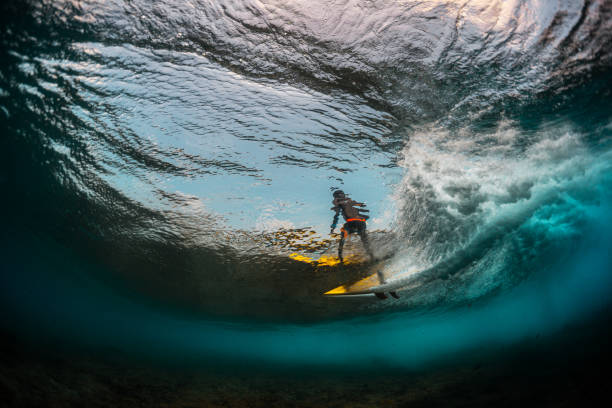 istock Underwater view of the surfer riding the wave 1218967458