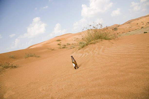 Bottle in the desert  Oman stock pictures, royalty-free photos & images