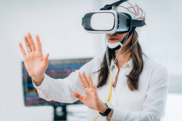 istock Brainwave EEG Experiment in Neuroscience Research Laboratory. Female Patient Using VR or Virtual Reality Goggles 1218970042