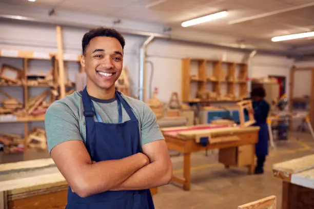 Photo of Portrait Of Male Student Studying For Carpentry Apprenticeship At College