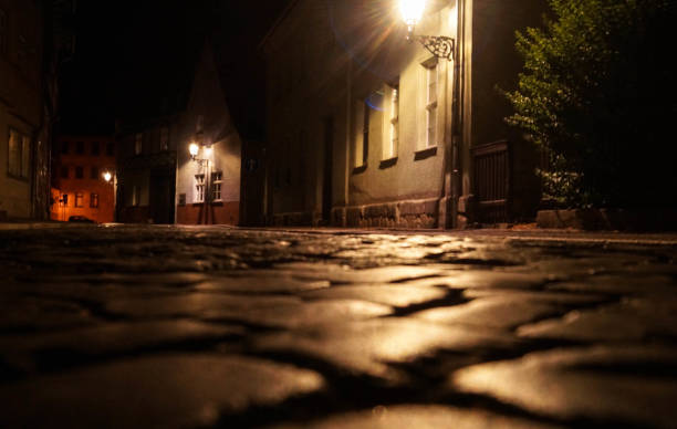 istock old street in the night 1218970990
