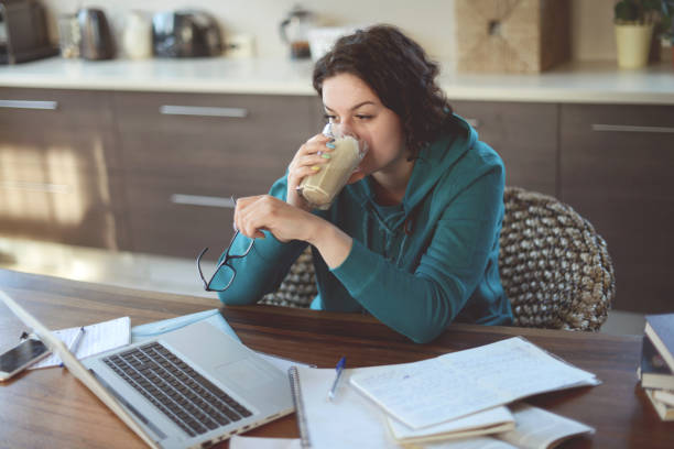 istock Beautiful young woman working at home 1218971890