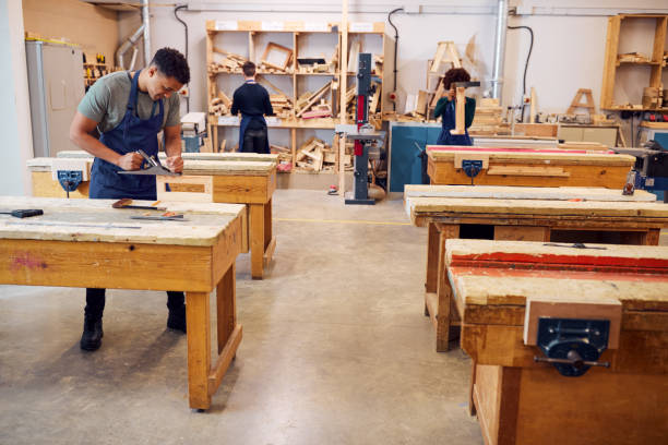 istock Wide Angle View Of Carpentry Workshop With Students Studying For Apprenticeship At College 1218971976