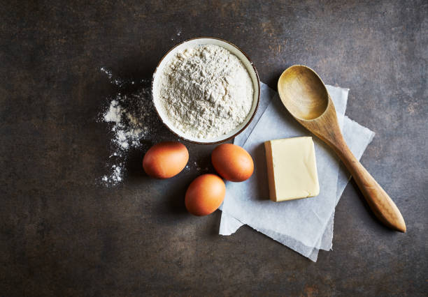 Baking ingredients on rustic stone background. Still life. Copy space stock photo