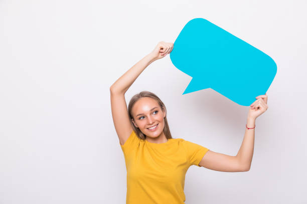 istock Young beautiful girl holding a green bubble for text, isolated on a white background 1218974108