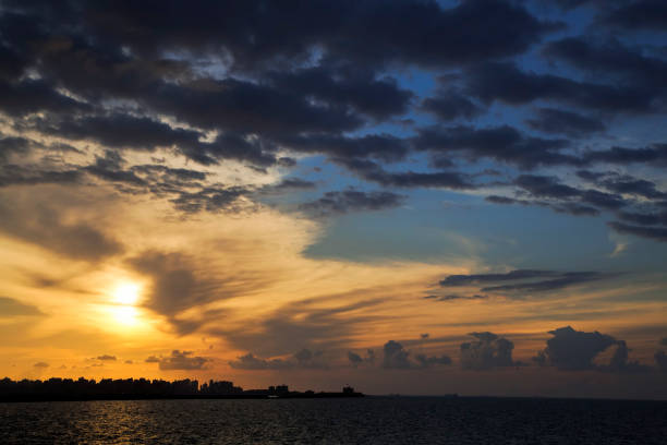 istock Silhouette of coast with cloudy sky in twilight 1218982132