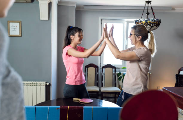 istock Playing table tennis at home 1218983056