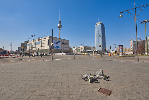 Berlin, Germany - 12. april 2020 empty Alexander Platz during corona virus covid19 pandemic in 2020, no people are on the streets and exit lock is required, it is a sunny day and all shops are closed