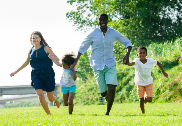 istock Family running in park 1218985548