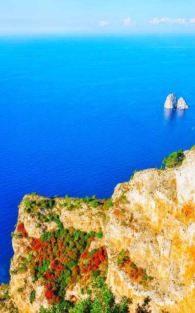Capri Island with Faraglioni of Italy at Naples. Amalfi scenery and Solaro mountain. Landscape with Blue Mediterranean Sea at Italian coast. Panorama of Anacapri in Europe. View in summer.