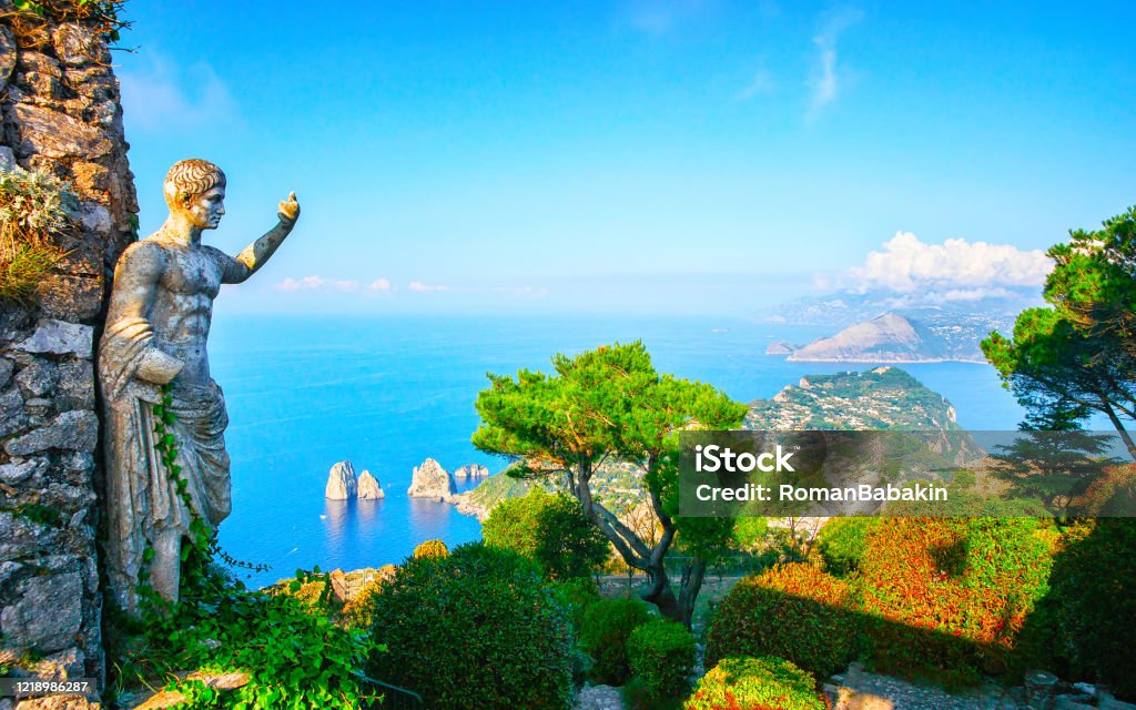 Statue And Gardens On Capri Island Reflex Stock Photo - Download