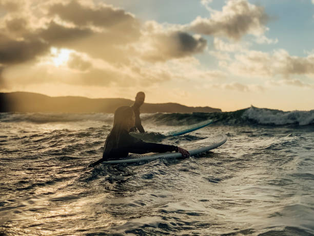 istock Surfing the Sea Together 1218987000