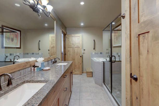 Beautiful large natural tones casual bathroom interior with nice wooden elements.