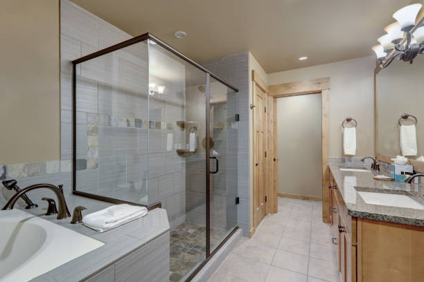 istock Beautiful large natural tones casual bathroom interior with nice wooden elements. 1218987870