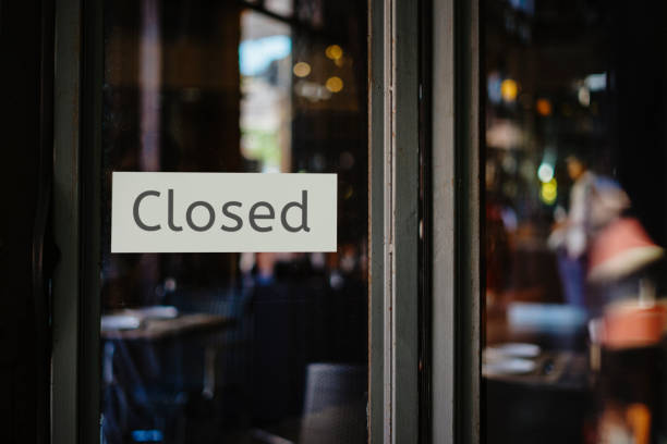 istock closed sign hanging outside a restaurant, store, office or other 1218988719