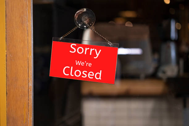 istock closed sign hanging outside a restaurant, store, office or other 1218988735