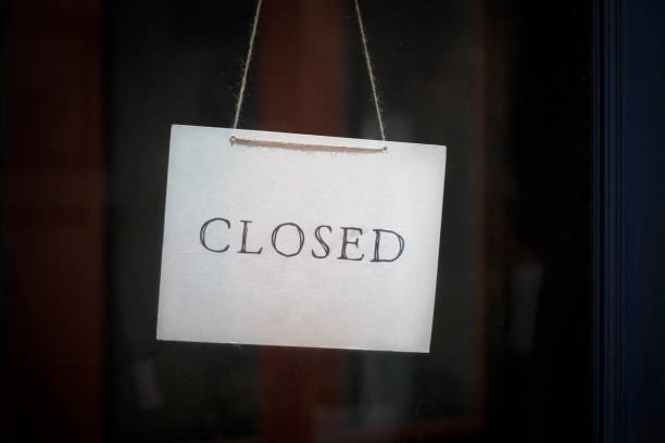 istock closed sign hanging outside a restaurant, store, office or other 1218988756