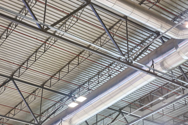 istock Warehouse building roof stainless air pipes. Ventilation structure equipment 1218989436