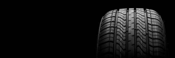 istock a  black isolation rubber tire, on the black backgrounds 1218990079