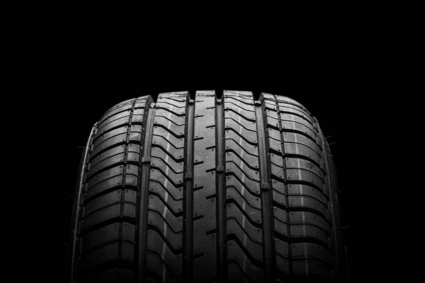 istock a  black isolation rubber tire, on the black backgrounds 1218990763